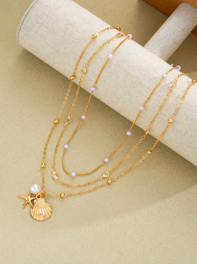 COLLAR TRES PIEZAS DE PERLAS ESTRELLA CONCHA
