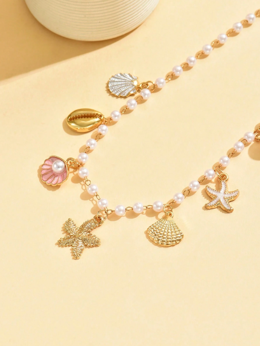 COLLAR CON DIJES Y PERLAS DE MAR